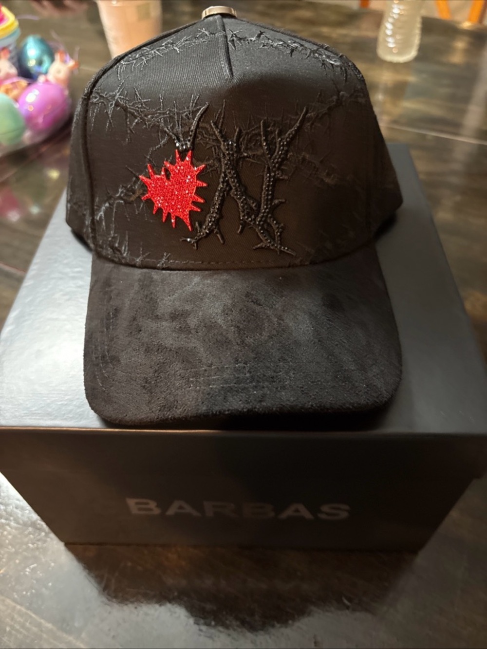 Black Embroidered Baseball Cap with Red Burst Accent